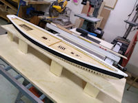 Top hull strakes with first coat of paint