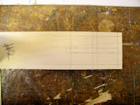 Thatch box window marked for cut out of panes