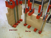 apple cider press -- press board and filler top clamped